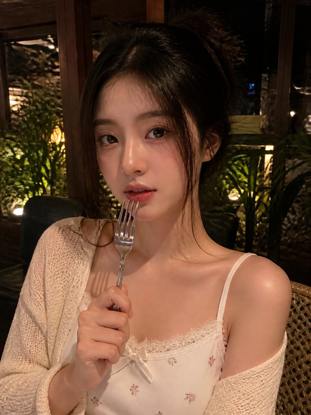 AI prompt example image: Low-light cafe smartphone portrait in Portrait & People